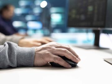 Cyber security experts in governmental hacking room working on securing networks